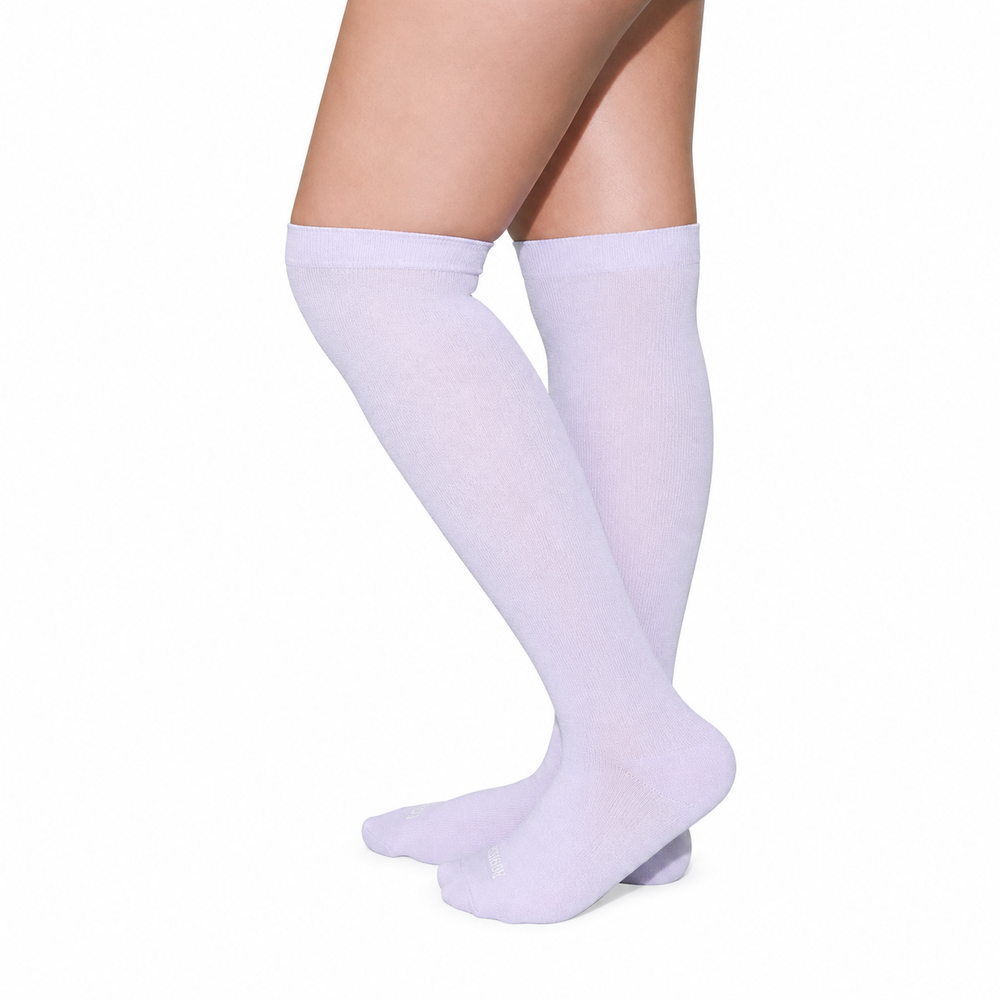 Lavender closed-toe socks showing the cuff and foot fabric.
