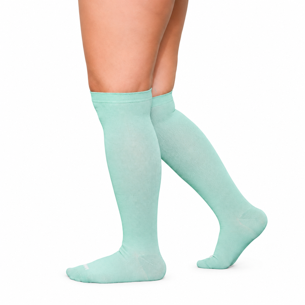 Mint knee-high socks shown from the side.