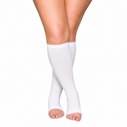White knee-high bamboo open-toe wide-calf compression socks shown on crossed legs.