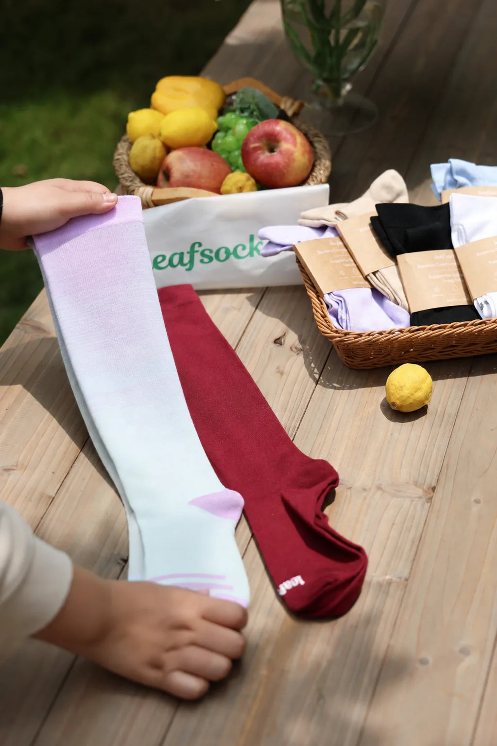 LeafSock compression socks in different colors arranged on a table