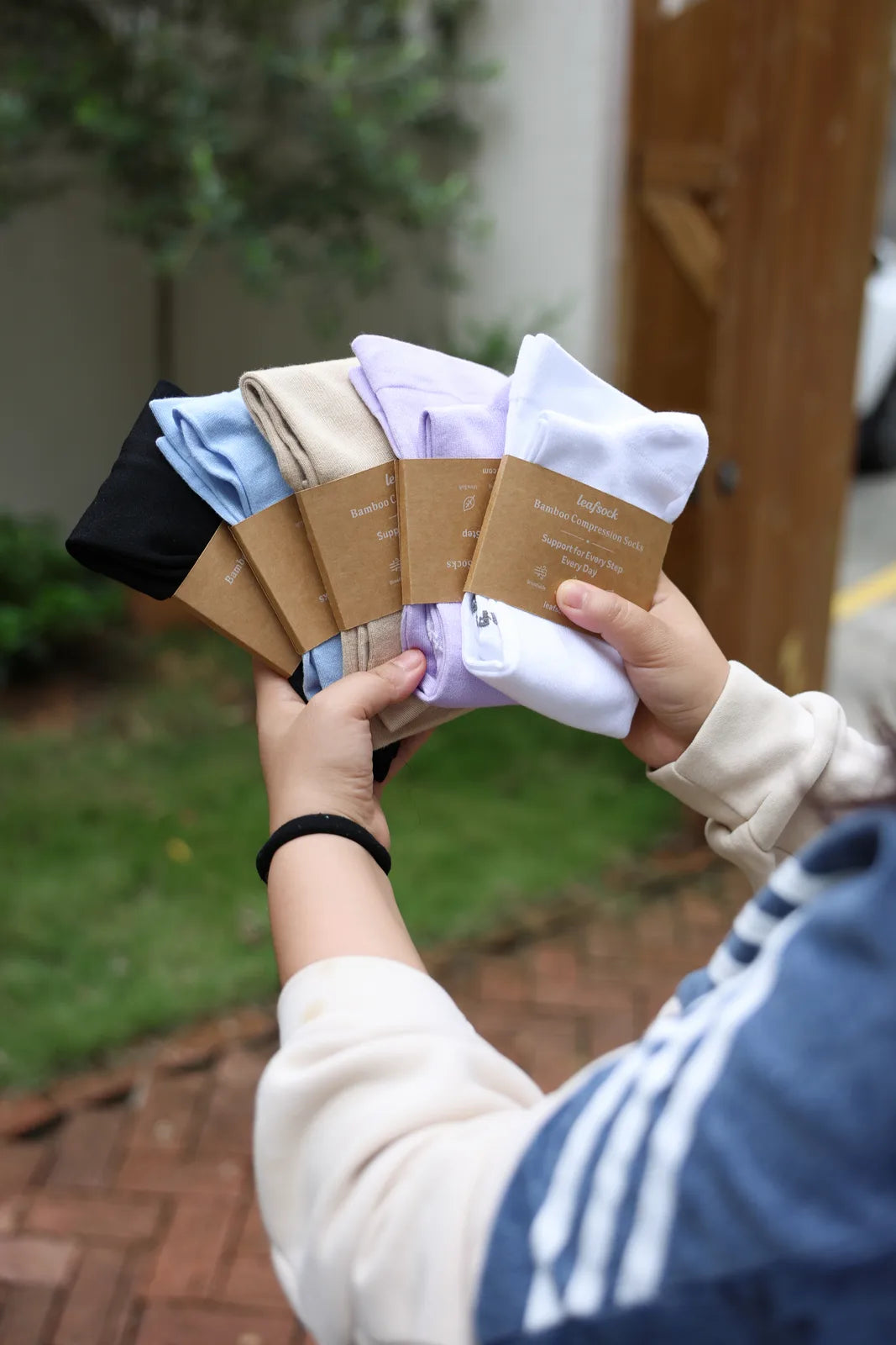 LeafSock compression socks displayed in a selection of colors